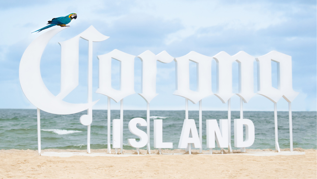 Corona Island Sign On A Beach